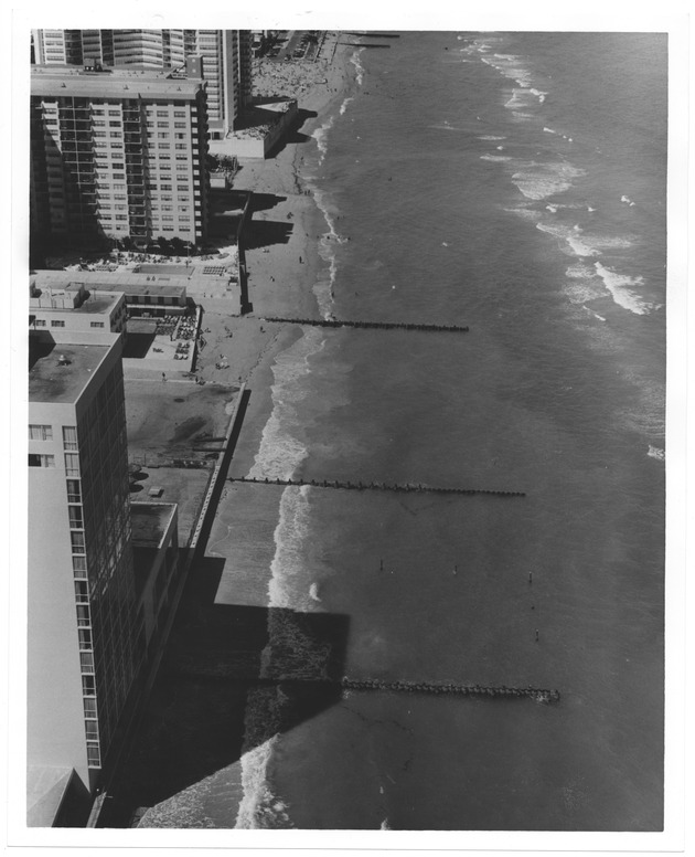 Aerial views of hotels on the ocean front during high tide - Recto Photograph