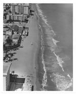 Aerial view of sandy area and buildings on the ocean front