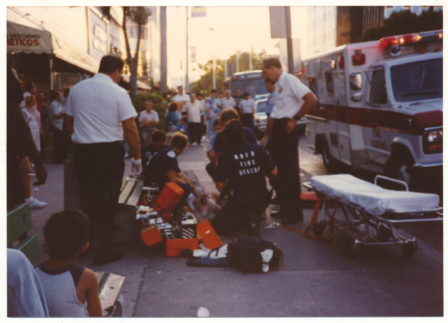 Paramedics assisting person - 