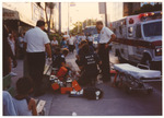 Paramedics assisting person