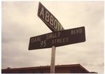 Isaac Singer Blvd and Abbott Avenue Street Signs