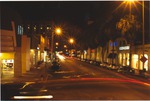 Streets and storefronts on Collins Avenue at night