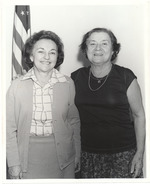 Unidentified women in front of American flag