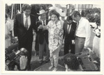 [1980/1990] Mayor Alex Daoud with woman giving a clay impression of her feet