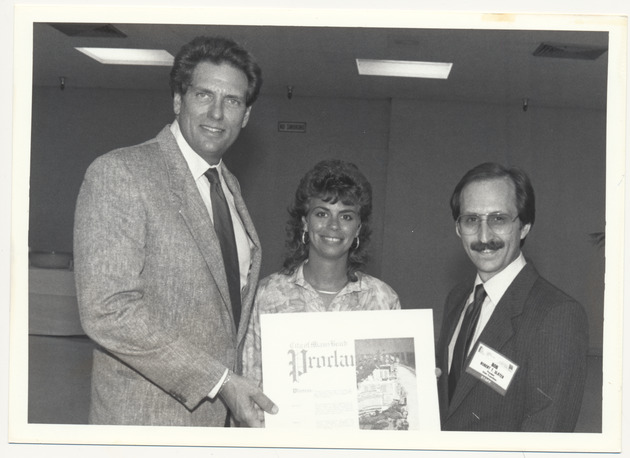 Alex Daoud giving a proclamation to Robert Slater and an unidentified woman - Recto Photograph