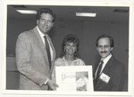 Alex Daoud giving a proclamation to Robert Slater and an unidentified woman