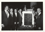 [1980/1990] Mayor Daoud and other officials standing with the Stephen Muss Convention Center plaque