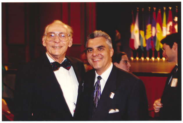 Mayor Gelber and unidentified man at Summit of the Americas event - Recto Photograph