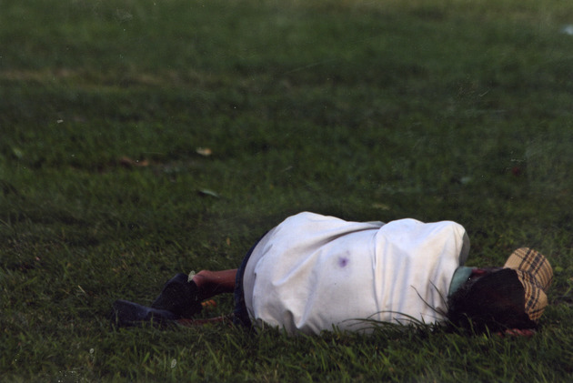 Man laying on grass - 
