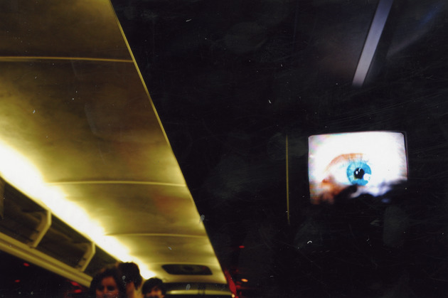 Interior of bus, with eyeball on TV screen - 