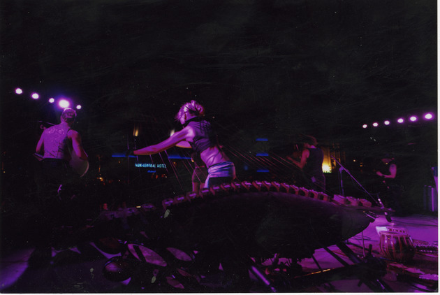 MASS Ensemble playing Earth Harp on stage - Image 1