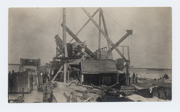 Pile drivers building the railroad