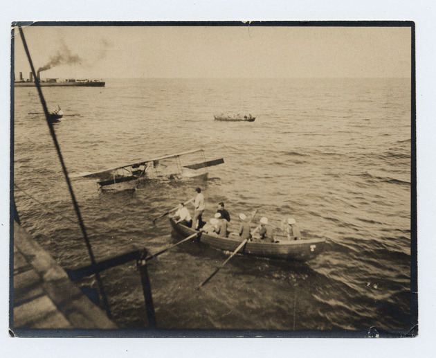 McCurdy's plane being towed alongside a Navy DD