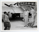 Mayor Louis and Mrs. Eisner boarding a plane