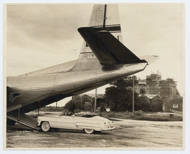 Airline Aerovias Q plane loading a car