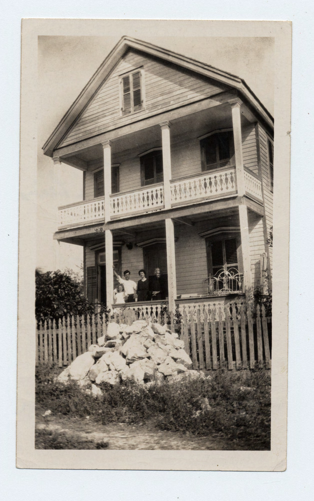 1401 Olivia St. with Lewis family on porch