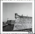 [1960] The northwest bastion of the Castillo de San Marcos, with people standing on the terreplein, and the northeast bastion behind, looking East, ca. 1960