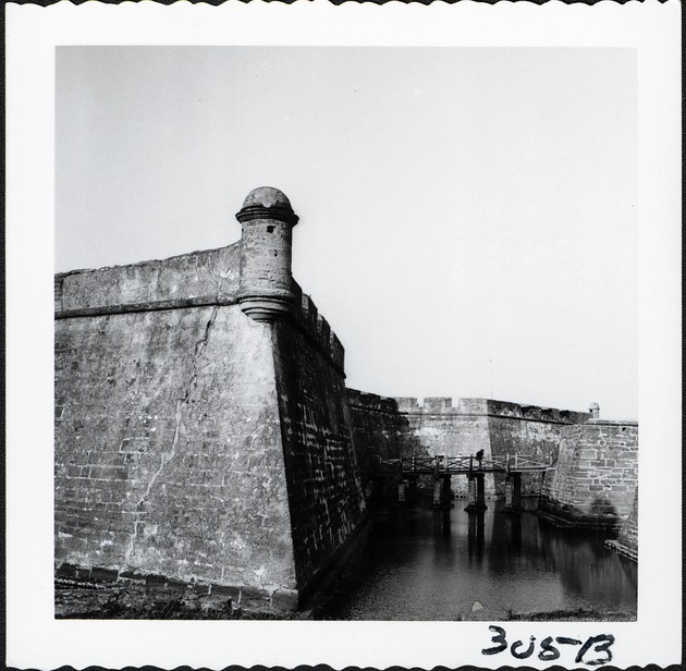 The southwest bastion of the Castillo de San Marcos with the bridge to the entrance to the Castillo and the southeast bastion in the background, looking East, ca. 1960