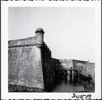[1960] The southwest bastion of the Castillo de San Marcos with the bridge to the entrance to the Castillo and the southeast bastion in the background, looking East, ca. 1960