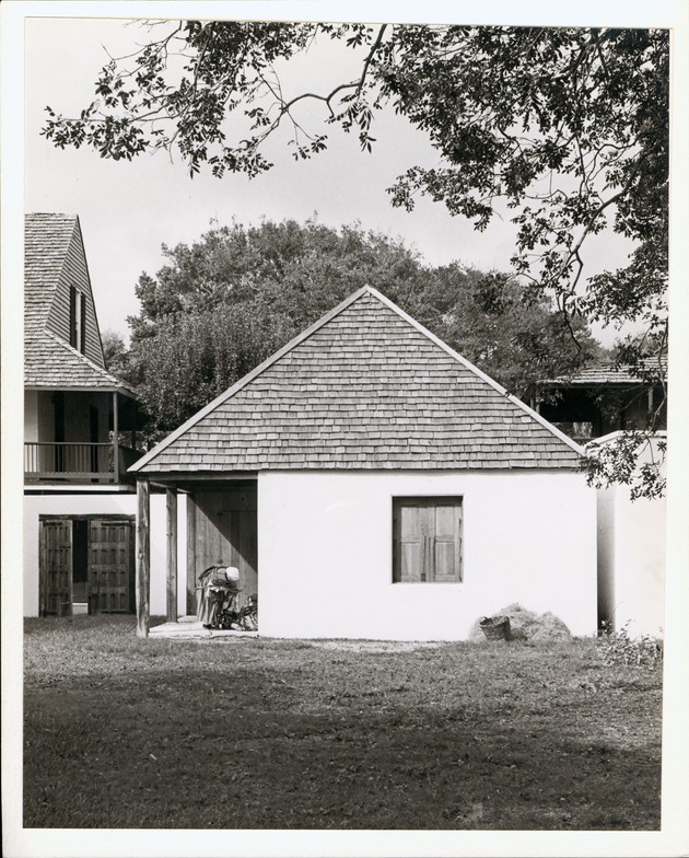 [Gonzales House from rear yard, closed with interpreter in period dress gathering items, looking West] - 