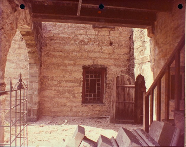 [Behind Avero House, at the base of the stairs under the second story loggia, facing the De Mesa Sanchez House, looking South] - 