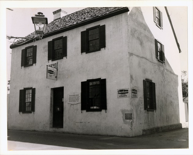 [Oliveros House with sign for "Roberto Camino Hand Made Cigars" from the corner of St. George Street and Cuna Street, looking Northeast] - 