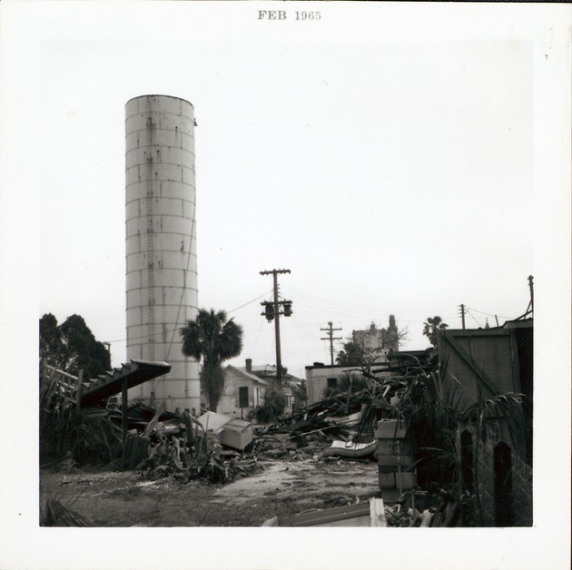 [Water tower and demolition debris on back of Block 8 Lot 3 (currently Tocques parking lot) prior to construction of Pan American Building, looking South, 1965] - 