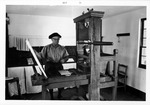 Jake Goff operating printing press at Wells Print Shop, 1971