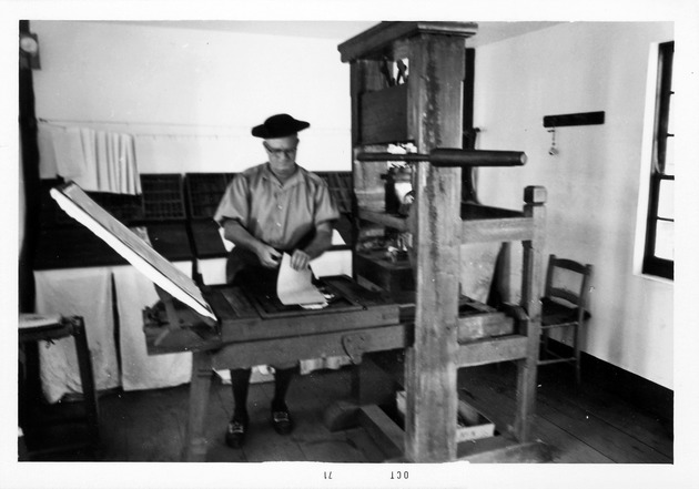 Jake Goff operating printing press at Wells Print Shop, 1971