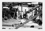 Construction of the Herrera House, pouring sidewalk, looking East