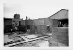 Construction of the Herrera House, with sidewalks poured, looking Southwest