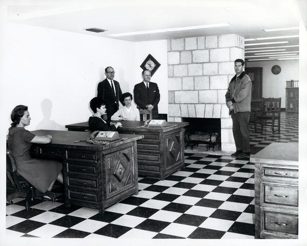 Herrera House interior, office area, Southern Bell Telephone staff seated at desks, Historic St. Augustine Preservation Board staff standing, 1967