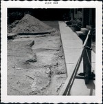 Archaeological excavations at the Tucker Lot, prior to the construction of the Carmona House from northern edge of the property line, looking West, 1962