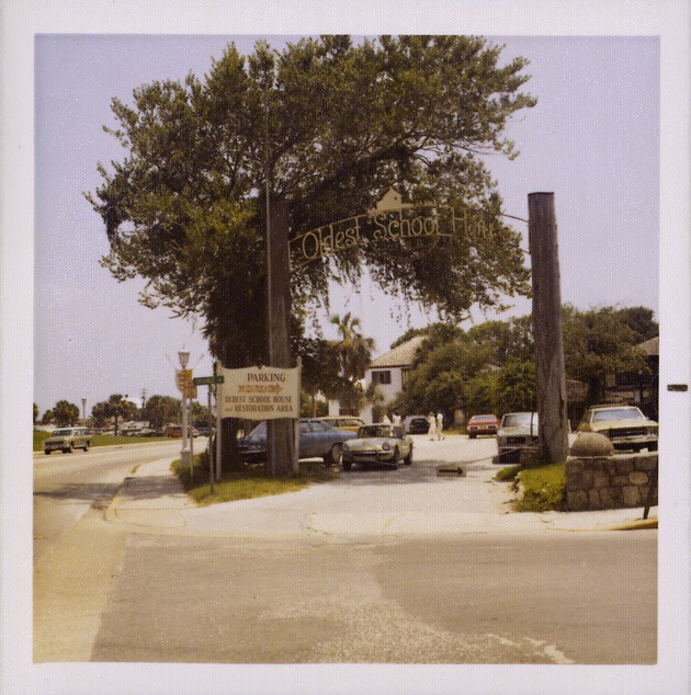 Sign and entrance for Oldest School House parking lot from the corner of Orange Street and South Castillo Drive, looking South