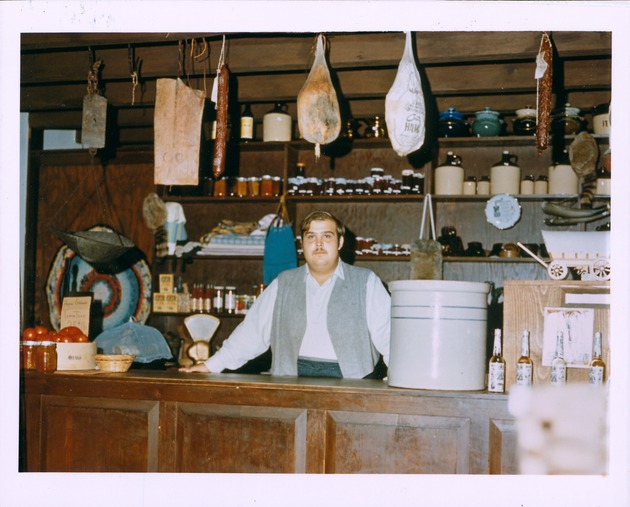 Interior of Benet Store with George Annas at store counter, 1971