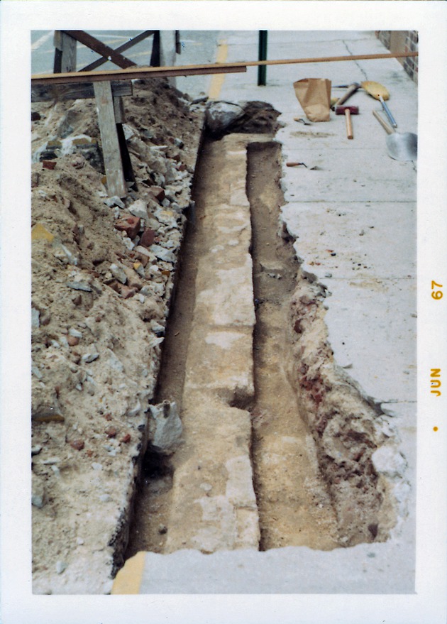 Construction of the Benet Store, exposing the eastern edge of the original foundations, looking South, 1967