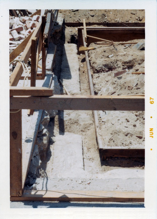 Construction of the Benet Store, exposing the southern edge of the original foundations, looking West, 1967