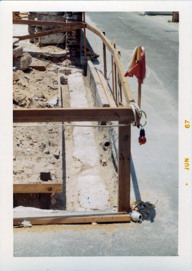 Construction of the Benet Store, exposing the northern edge of the original foundations, looking West, 1967