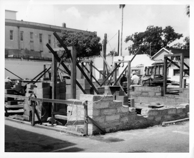 Begininning construction of the Benet Store from the corner of St. George Street and Cuna Street, looking Southwest