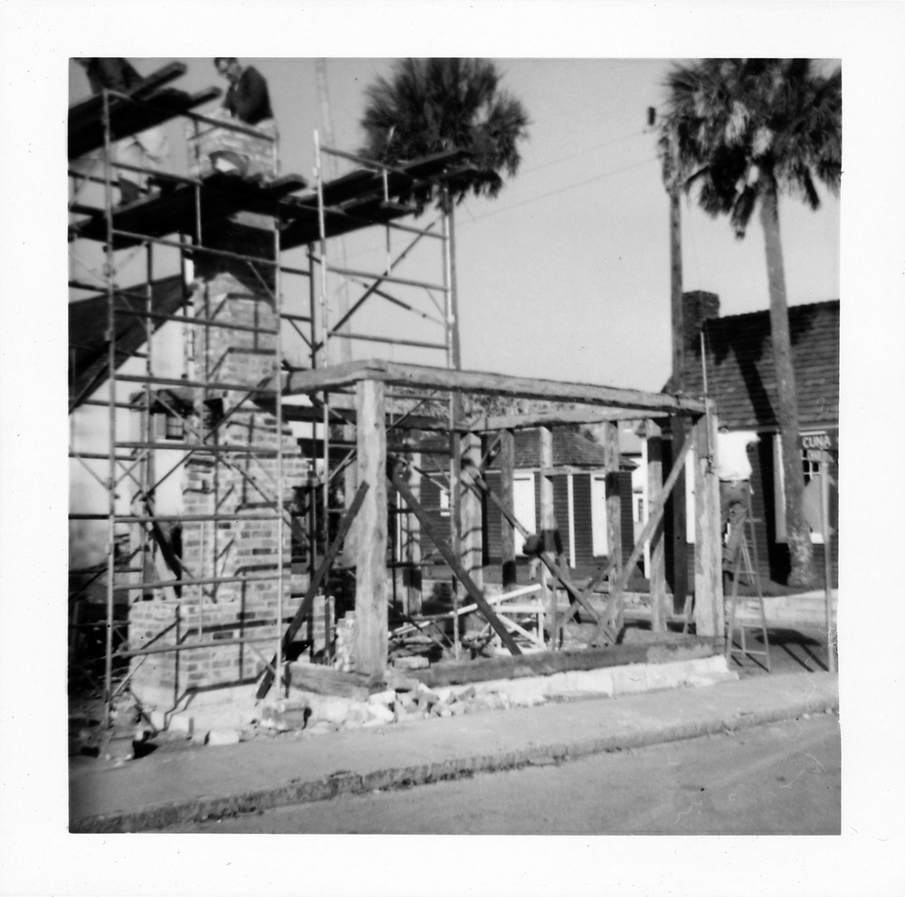 Construction of the chimney for the Old Blacksmith Shop from Charlotte Street, looking Northwest, 1967