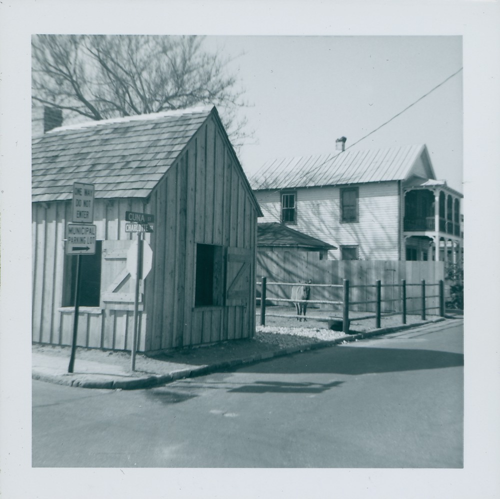 Old Blacksmith Shop from the corner of Charlotte Street and Cuna Street, with burro in the background