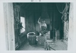 Old Blacksmith Shop, interior, Coco Mickler at work, looking South, 1968