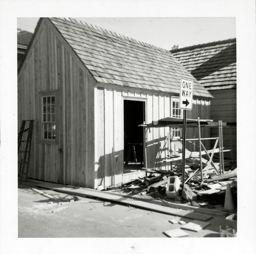 Construction work on rear of Wells Print Shop from Cuna Street entrance to Toques Place parking area, looking Northeast, 1968