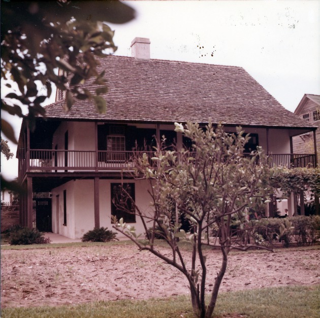 Arrivas House from rear yard, showing planted garden with small sprouts, looking East, 1971