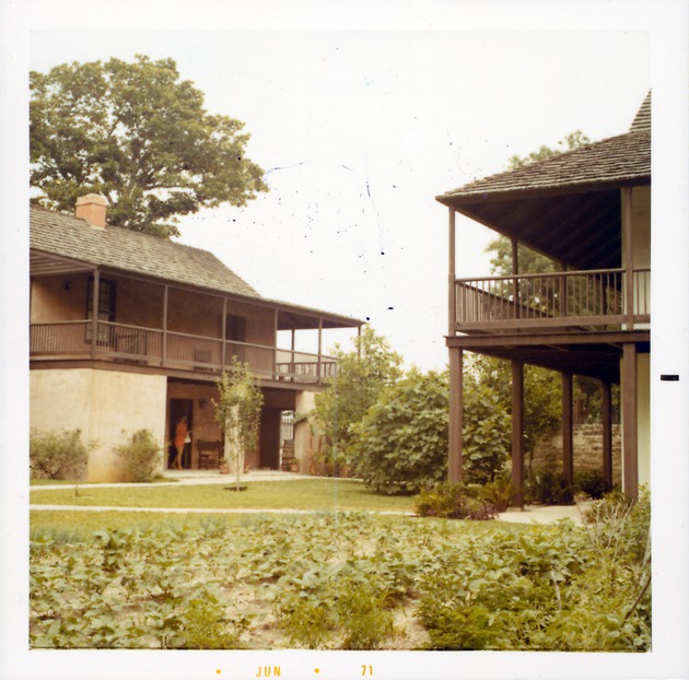Northwest corner of the Arrivas House on the right and the Salcedo House on the left, from the garden in the rear yard of the Arrivas House, looking Northeast, 1971