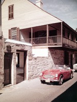 Arrivas House from St. George Street with red sports car in front, looking Northwest