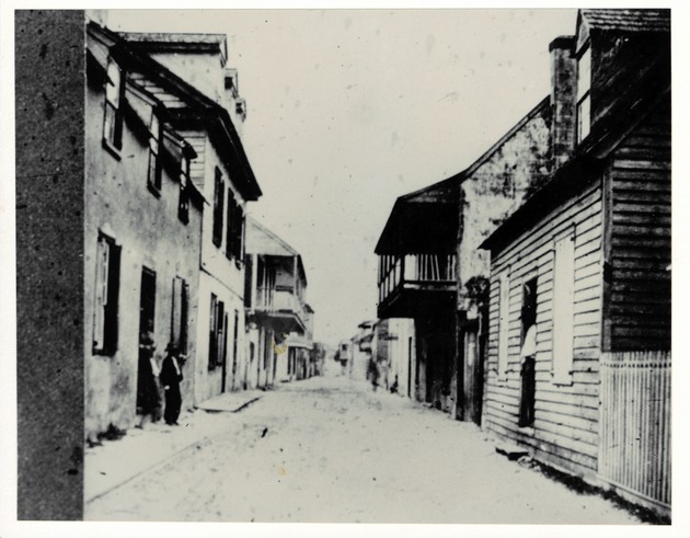 Historic view of St. George Street with Arrivas House on left with balcony, looking North