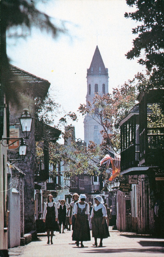 A fanciful view of St. George Street with tourists and interpreters in period dress from in front of the Triay House, looking South - 
