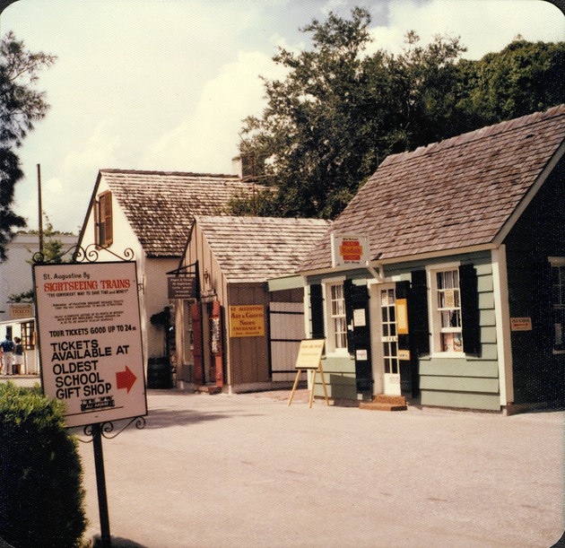 Signage for the Oldest Wooden School House on St. George Street and gift shop across the street, looking Southwest