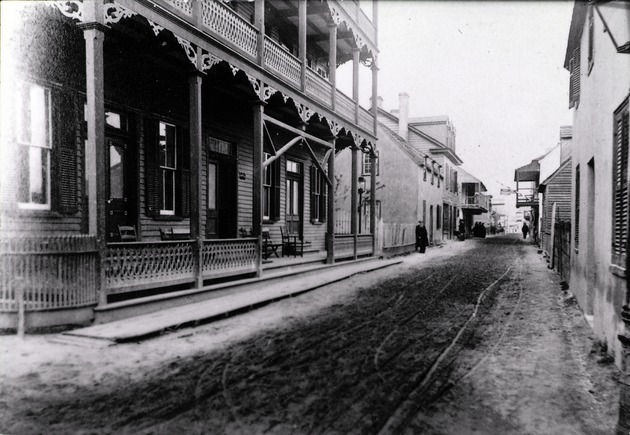 Historic view of St. George Street from the intersection with Cuna Street, with the Columbia Hotel on the left, looking North